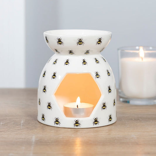 Charming Bee Print Ceramic Oil and Wax Burner with Lit Tealight and Candle Jar on Wooden Surface