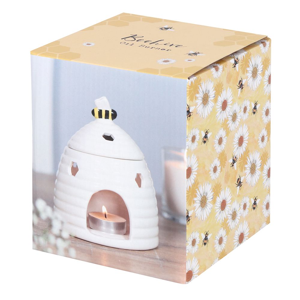 White Beehive Burner: Box Packaging with Angle View, Image of white burner with lit tealight and candle Printed, Yellow Background with White Flower and bees Design